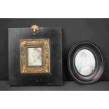 Two antique framed miniature portraits of ladies in traditional dress.