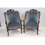 Pair of Early 20th century Mahogany Bergere Armchairs with scrolling carved frames, upholstered in