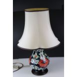 Moorcroft Table Lamp in the Red Poppy design, 34cms high, with shade