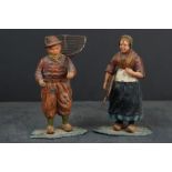 A pair of cold painted spelter figures of a Dutch fishing couple.