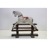 Early 20th century G & J Lines Wooden Grey Painted Rocking Horse on Trestle Base, with glass eyes,