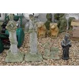 A collection of four reconstituted stone outdoor ornaments.