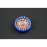 Small Perthshire Millefiori Glass Paperweight with a P marked to centre cane