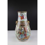 Chinese Cantonese Famille Rose Vase, pear shaped and decorated with figures and gilded ringed dogs