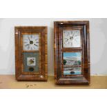 Two vintage wooden cased American wall clocks with decorative glass panels.
