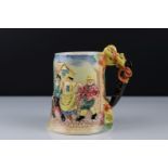 Ceramic Musical Tankard with relief decoration of village folk dancing, with Thorens movement
