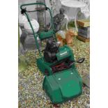 A Qualcast classic petrol 35s lawnmower.