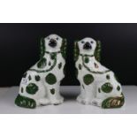 Two Staffordshire Mantle Dogs with green and white finish, tallest 26cms high