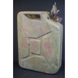 A British military issued jerry can dated 1975 and marked with the British broad arrow.