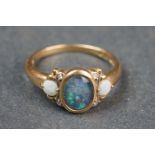 A fully hallmarked 9ct gold & opal dress ring.