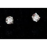 Pair of 14ct white gold diamond stud earrings of approx. 65 points total weight