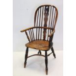 Early 19th century Ash and Elm Comb Back Windsor Elbow Chair, 105cms high