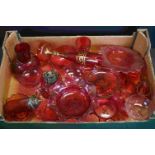 A large collection of vintage cranberry glass to include vases, jugs and glasses.