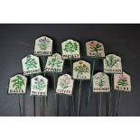 A collection of twelve herb garden metal marker signs.