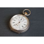 A vintage white metal pocket watch, engraved to verso.