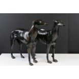 A pair of large cast iron figures of Greyhounds, approx 30cm in height.