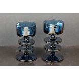 Two Wedgwood blue glass Sheringham candlesticks, designed by Ronald Stennet Wilson.