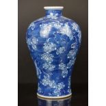 Chinese Porcelain Meiping style Vase decorated with stylised flowers on a blue ground, Qianlong mark