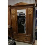 Victorian Walnut Wardrobe, the single mirrored door opening to a hanging space above a drawer,