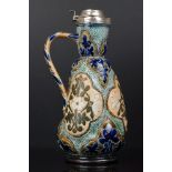 Doulton Lambeth Stoneware Claret Jug with floral decoration and hallmarked silver hinged lid,