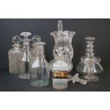 A collection of mixed glassware to include decanters, vases and apothecary bottle.