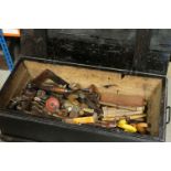 A wooden carpenters tool trunk complete with contents to include wood planes, braces, drills..etc.