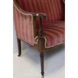 Edwardian Mahogany Inlaid Salon Settee upholstered in a pink striped fabric, 107cms long x 89cms