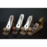 A small collection of four carpenters wood planes to include Stanley and Woden examples.