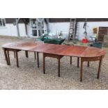 George III Mahogany Dining Table comprising a pair of D ends and two central drop flap sections,