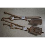 A two piece fireside companion set to include shovel and tongs, together with another