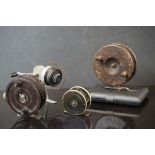 A collection of four vintage fishing reels together with a small collection of flies.