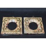 A pair of antique miniature picture frames with brass inlay decoration.