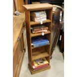 Pine narrow bookcase with fitted shelves