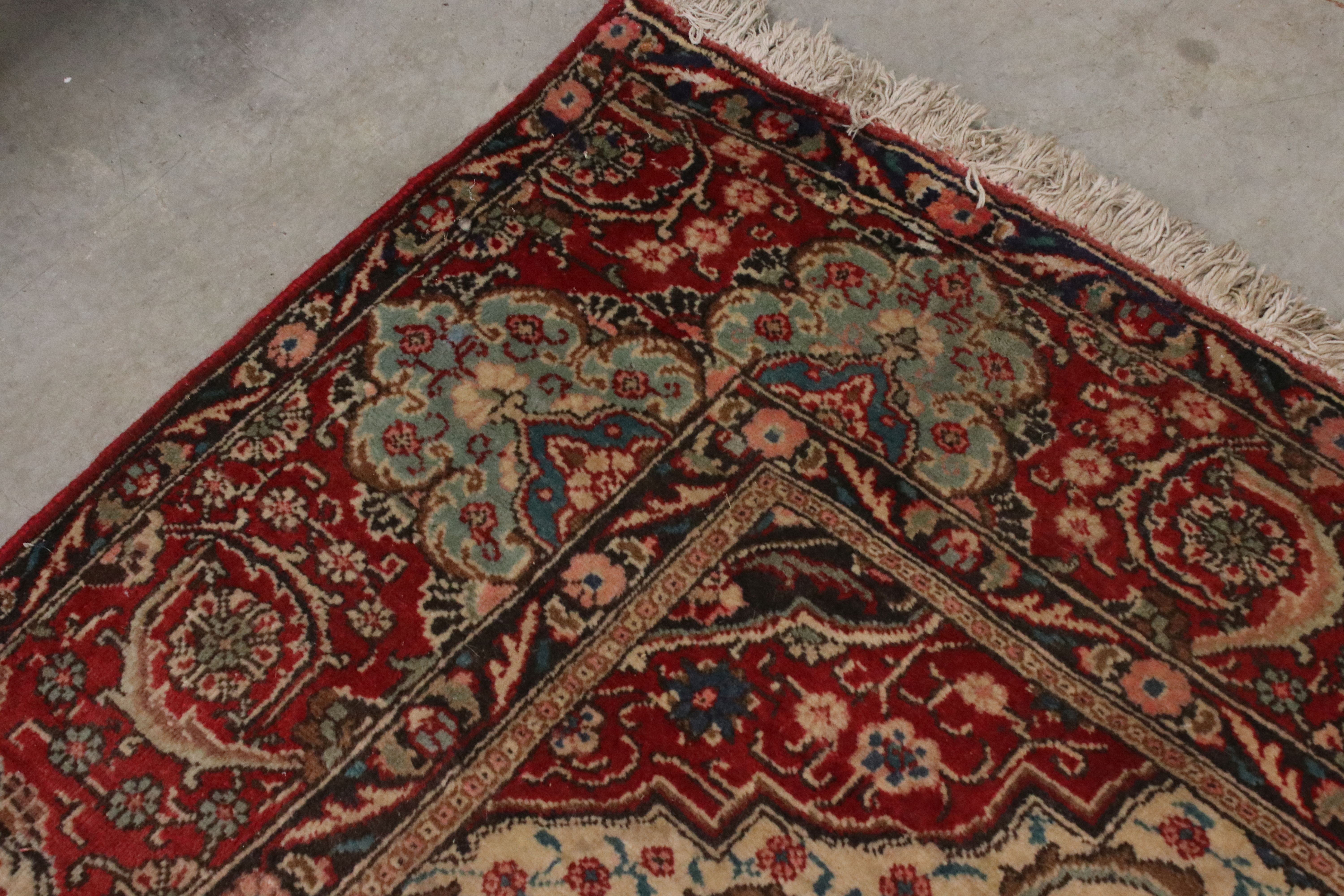 Large Wool Red Ground Rug with floral pattern within a border, 279cms x 396cms - Image 6 of 10