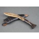 A brass Kukri shaped letter opener with horn handle inscribed 'Presented By British Gurkhas Nepal