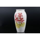Moorcroft Vase decorated with red and yellow flowers on a white ground, impressed Moorcroft mark