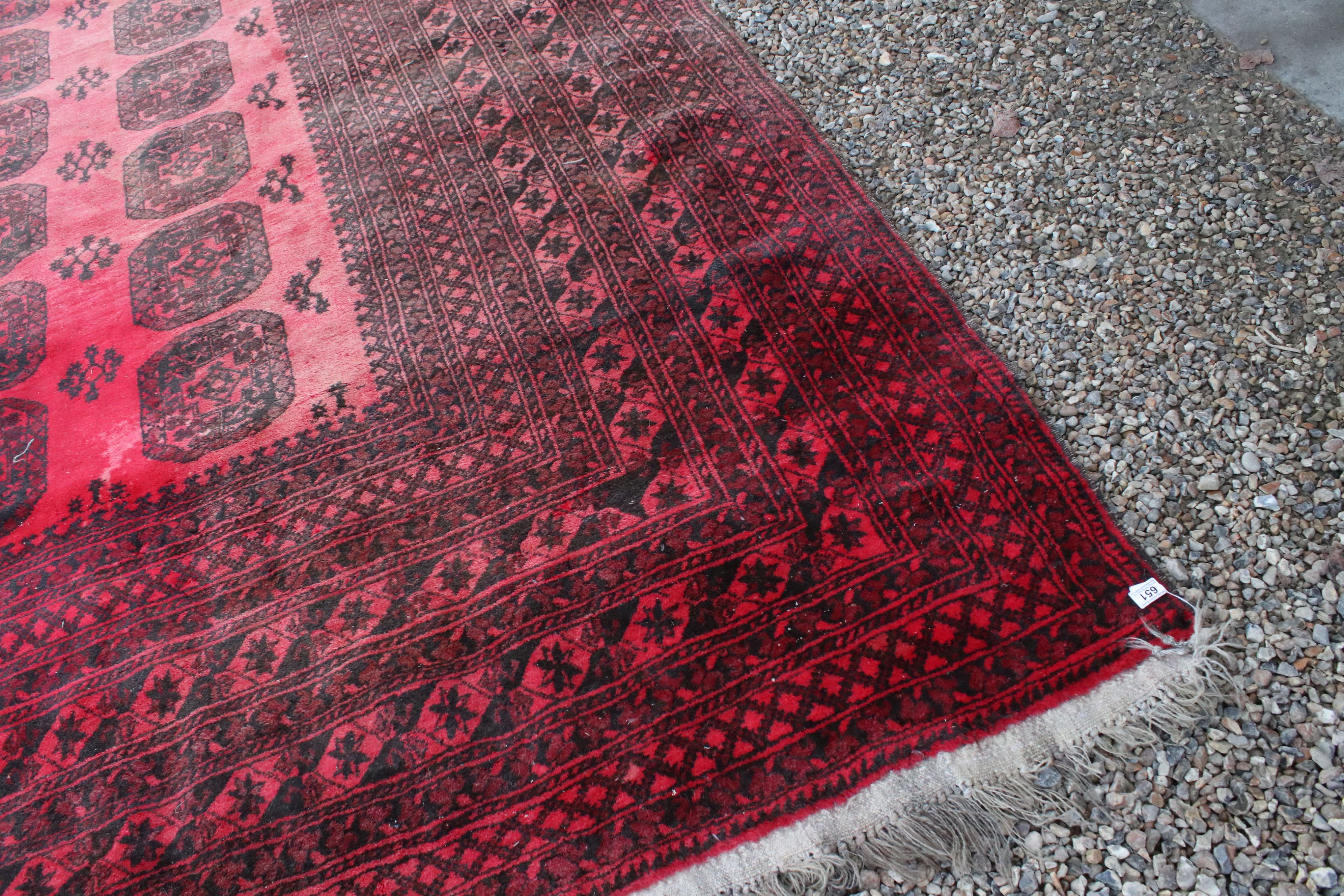 Large Wool Red Ground Rug with geometric pattern within a wide border, 417cms x 313cms - Image 8 of 10