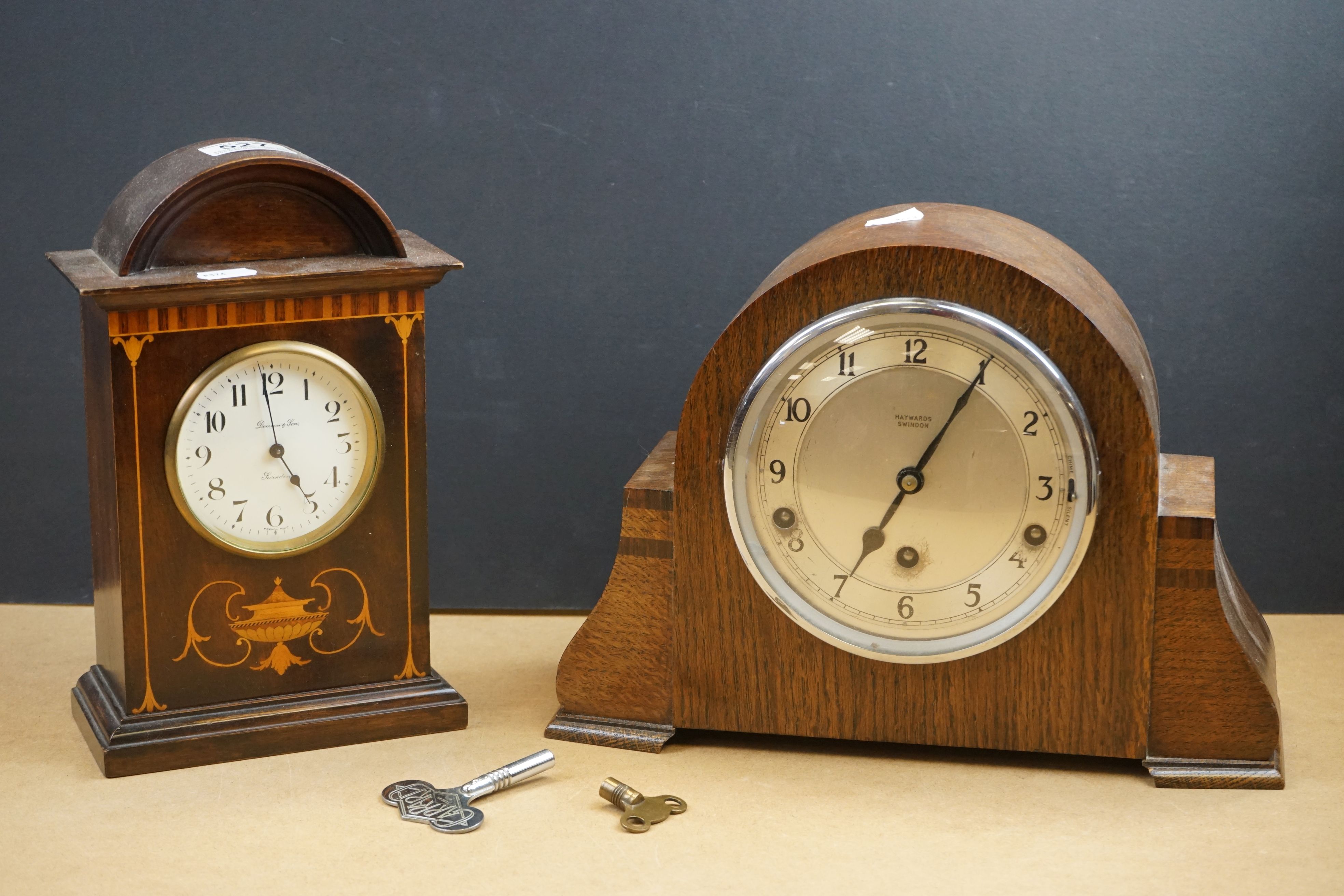 Two wooden cased mantle clocks to include a chiming example, both marked by Swindon retailers.