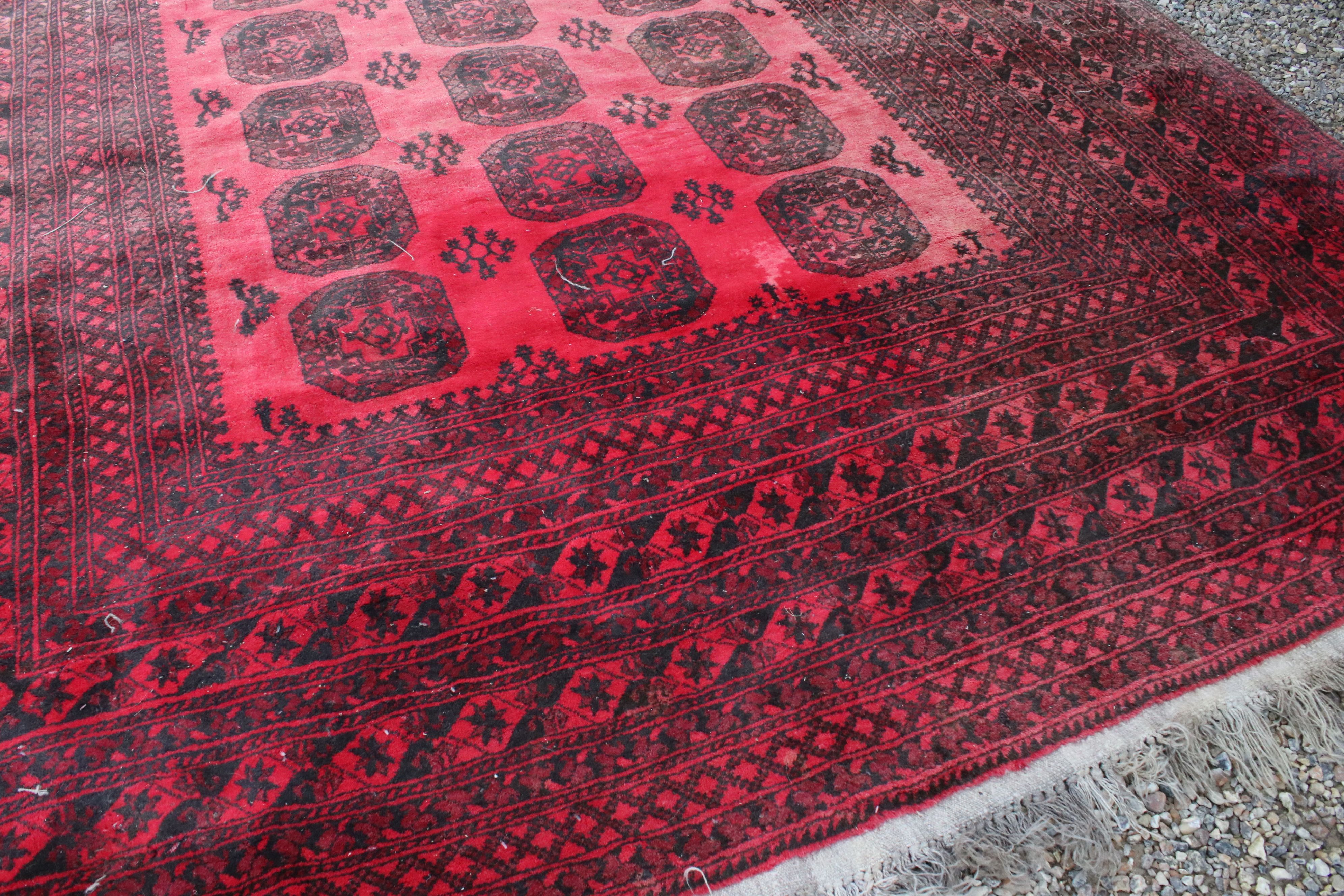 Large Wool Red Ground Rug with geometric pattern within a wide border, 417cms x 313cms - Image 7 of 10