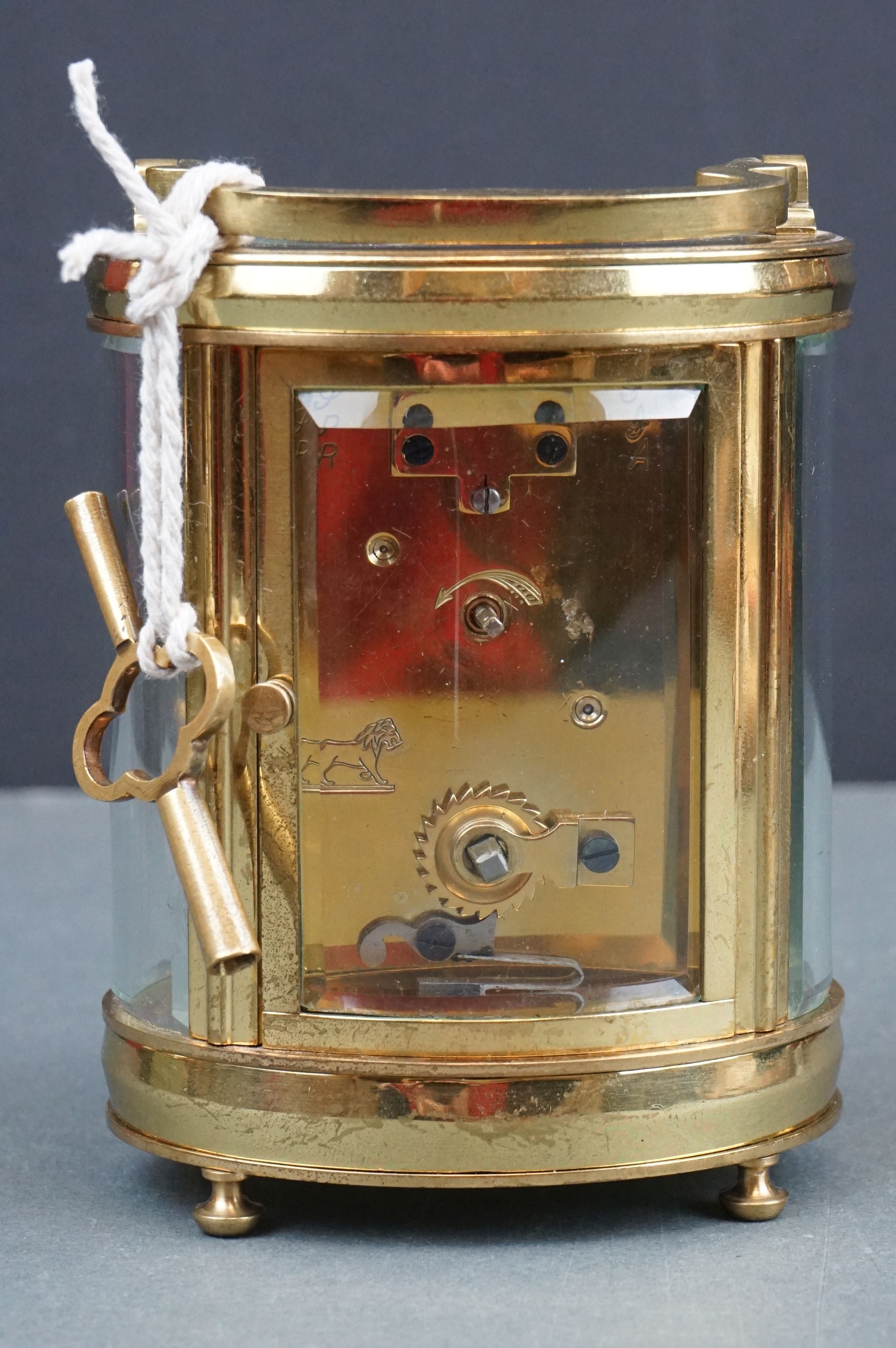 An antique brass cased carriage clock with white enamel dial, complete with key. - Image 5 of 9