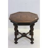 Oak Octagonal Centre Table jacobean revival raised on turned supports united by a x strecther, 78cms