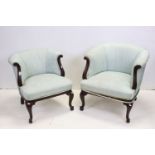 Two matching Victorian Tub Salon Chairs with pale blue upholstery and walnut scrolling frames,