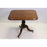 Regency Mahogany and Cross-banded Rectangular Tilt Top Table raised on a turned column support and