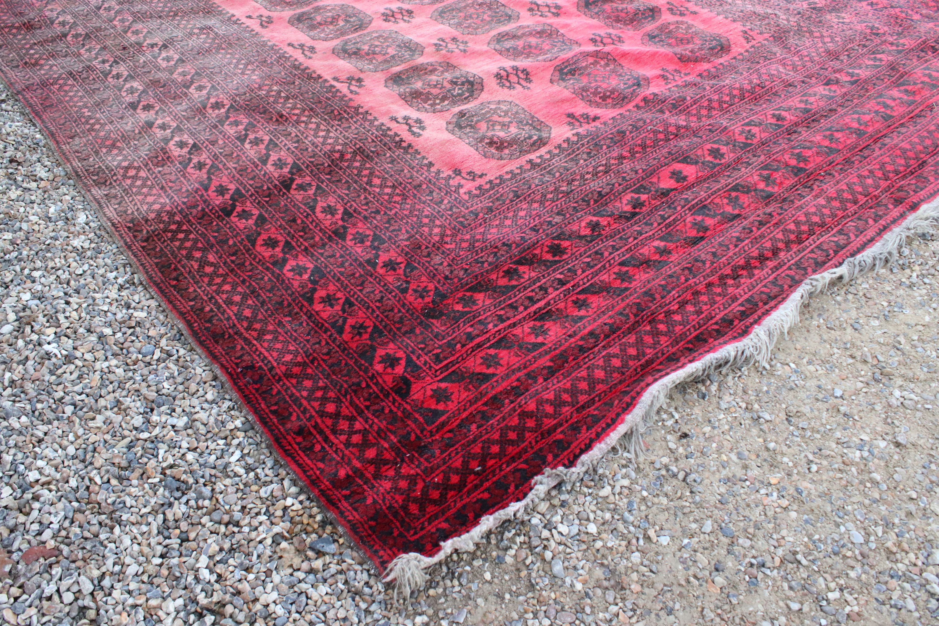 Large Wool Red Ground Rug with geometric pattern within a wide border, 417cms x 313cms - Image 3 of 10