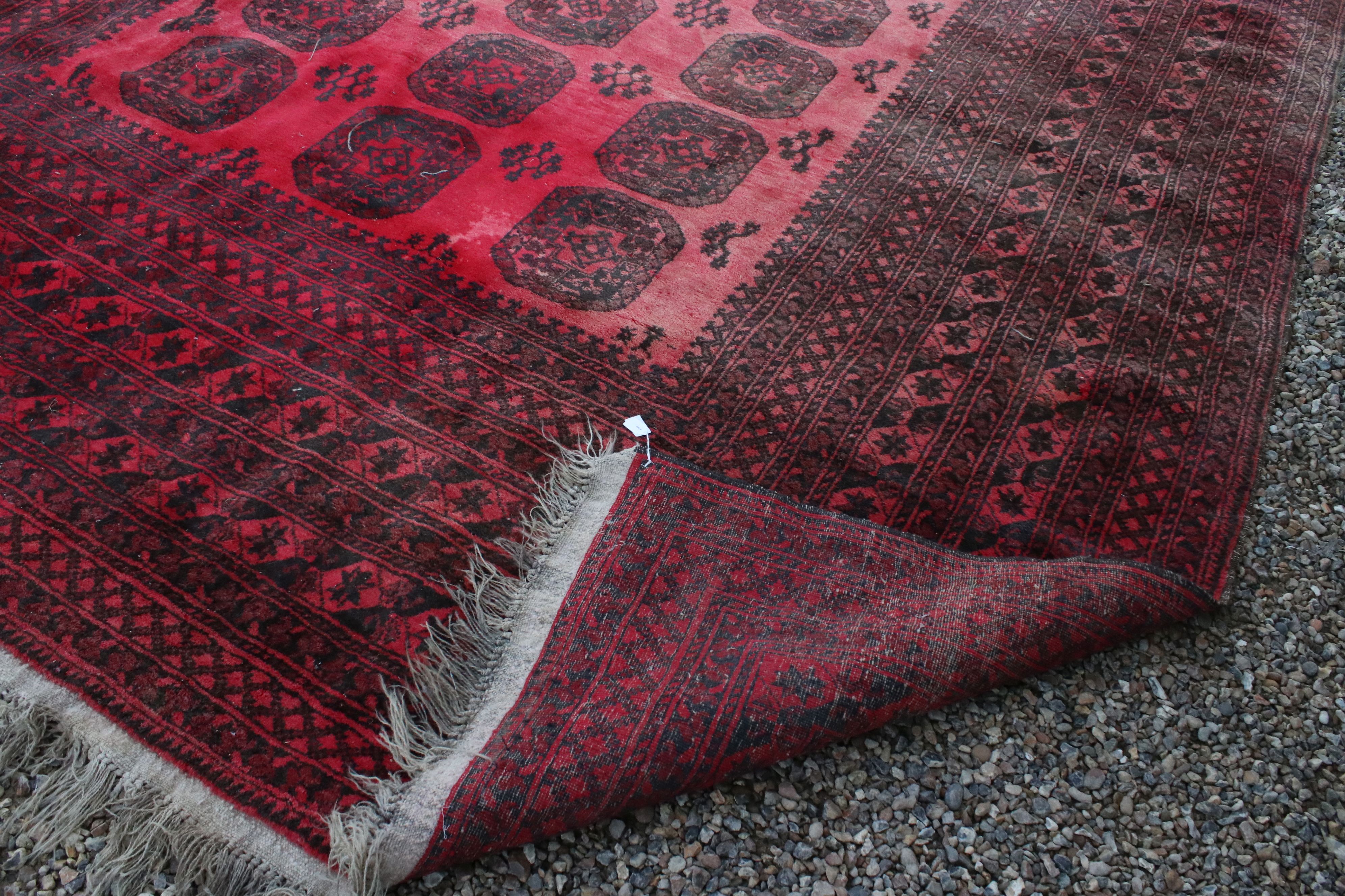 Large Wool Red Ground Rug with geometric pattern within a wide border, 417cms x 313cms - Image 9 of 10