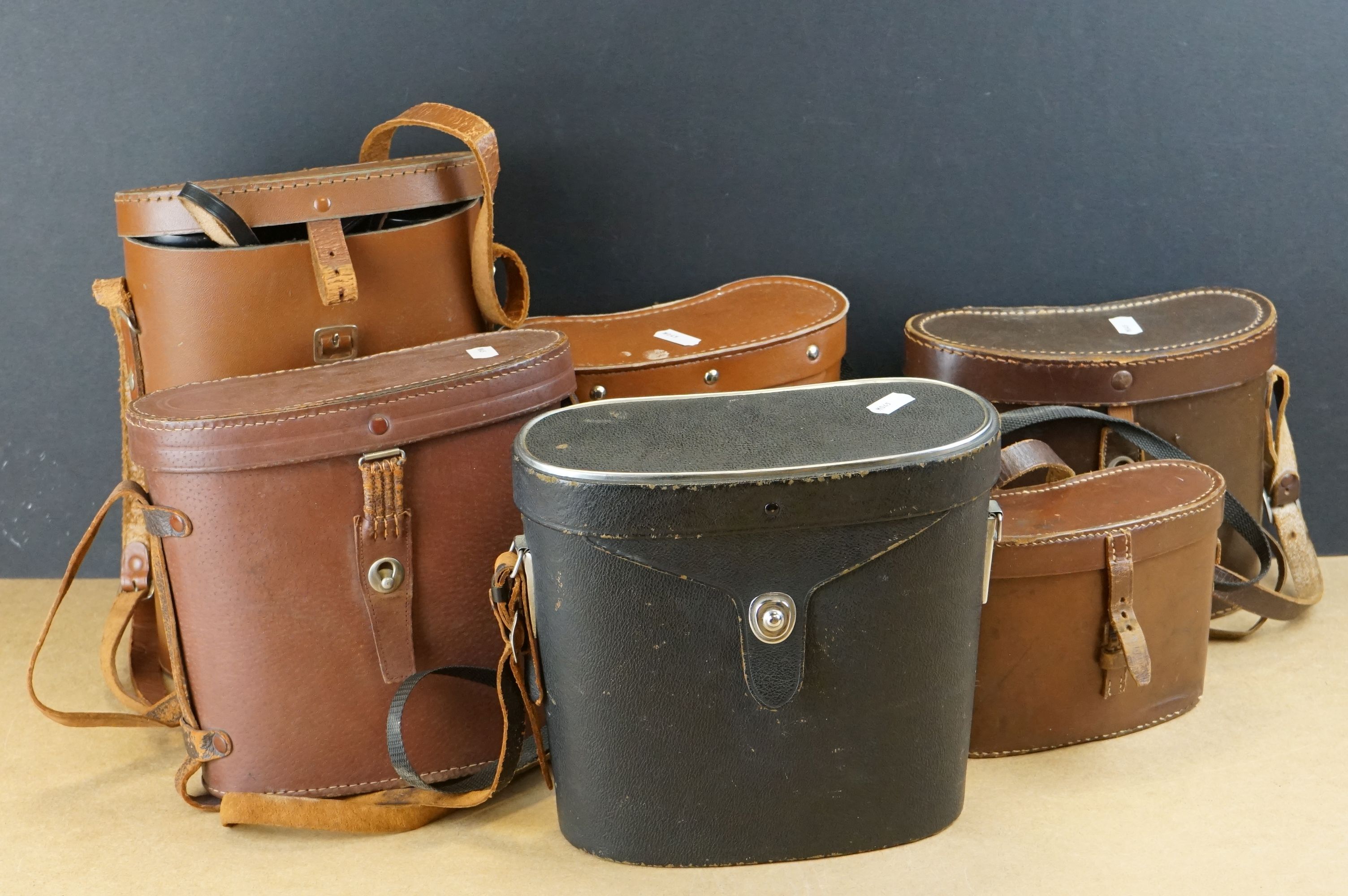 A collection of six pairs of binoculars in original leather cases.