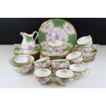 A Minton Cockatrice Tea set to include cups, saucers, plates, side plates, milk jug and sugar bowl.
