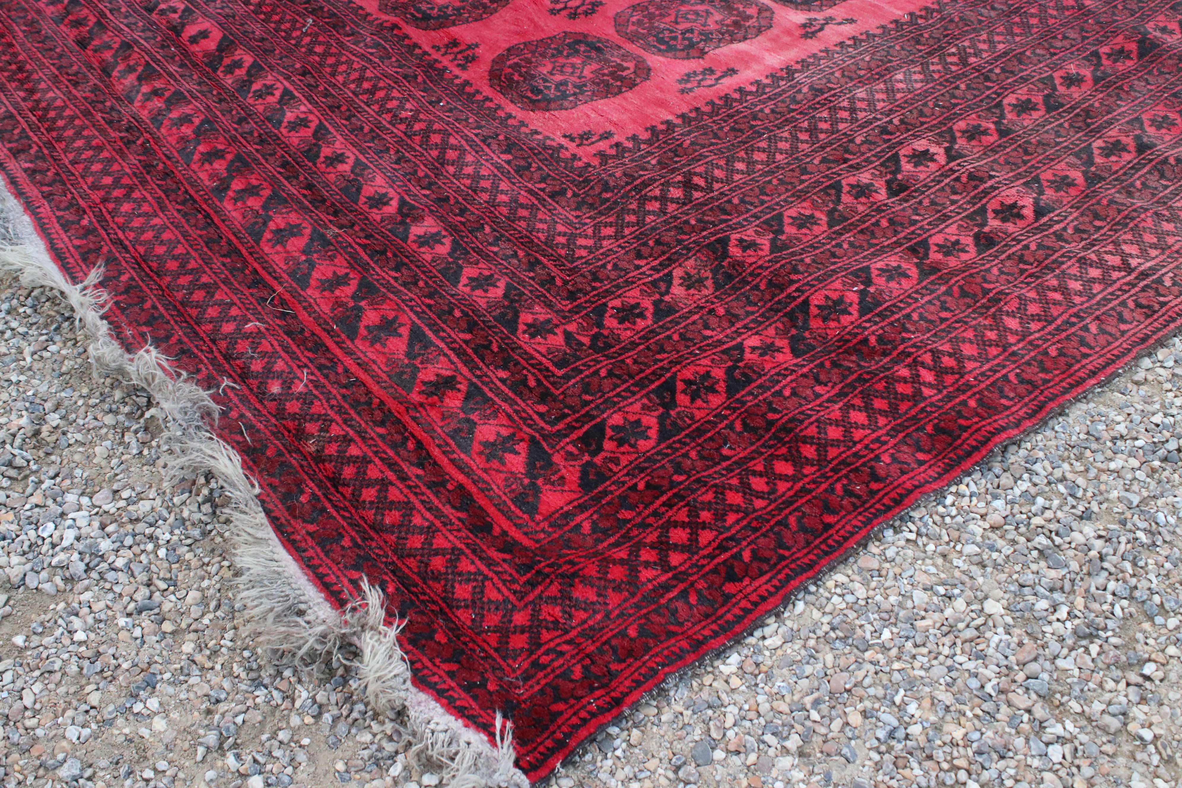 Large Wool Red Ground Rug with geometric pattern within a wide border, 417cms x 313cms - Image 4 of 10
