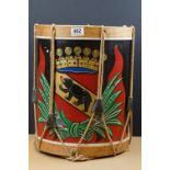 A wooden paper bin in the form of a drum