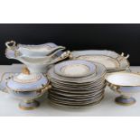 19th century Porcelain Dessert Service decorated with gilt and a pale blue border comprising Large